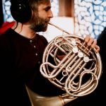 Rob Jost playing French horn